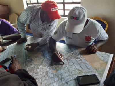 Men in Mukuru during CHV mapping exercise