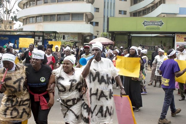 Emily (pictured second from the left) participating in peaceful demonstrations in Nairobi, calling an end to forceful evictions