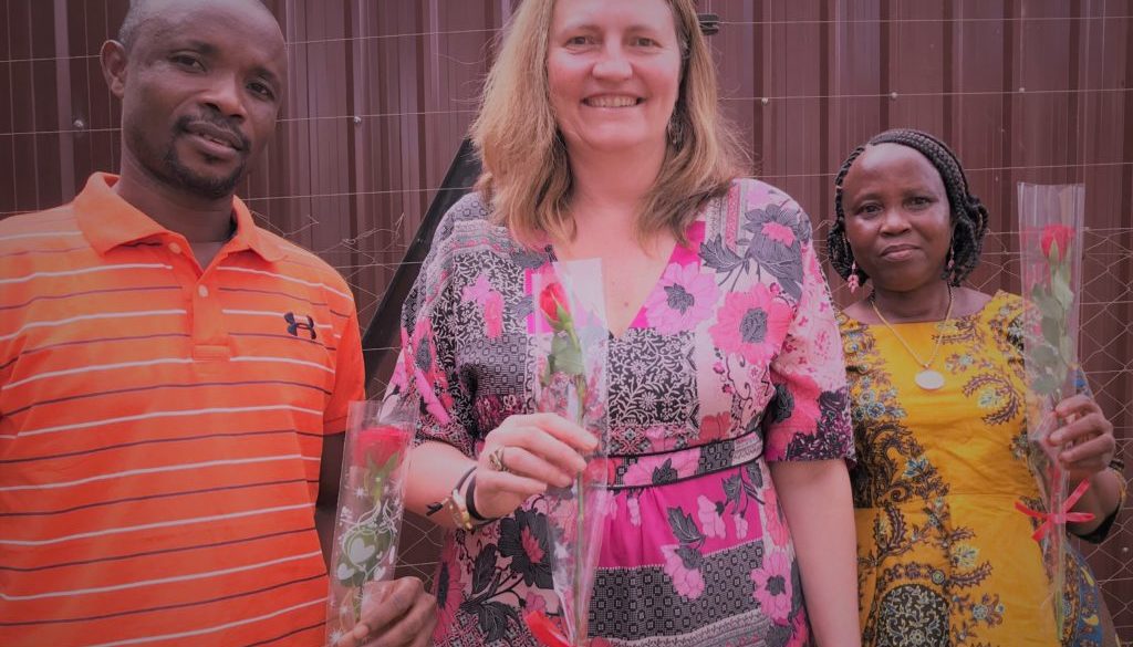 A photo of the blog authors holding roses for Valentine's Day