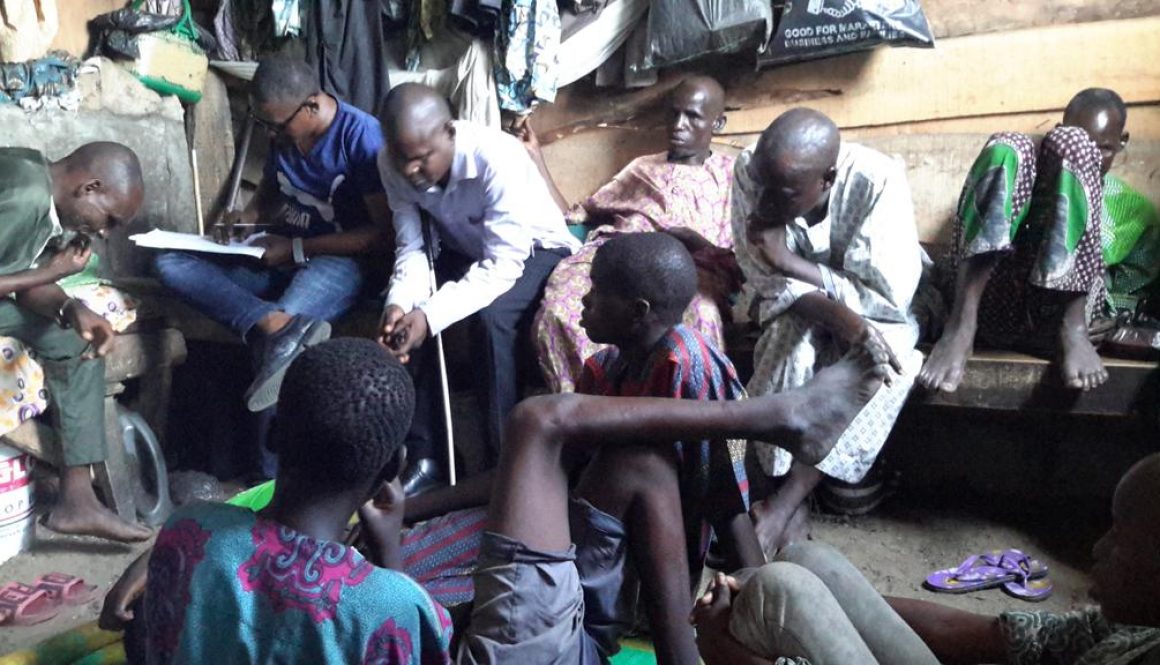 A number of people in a very crowded room where they live in Lagos, Nigeria