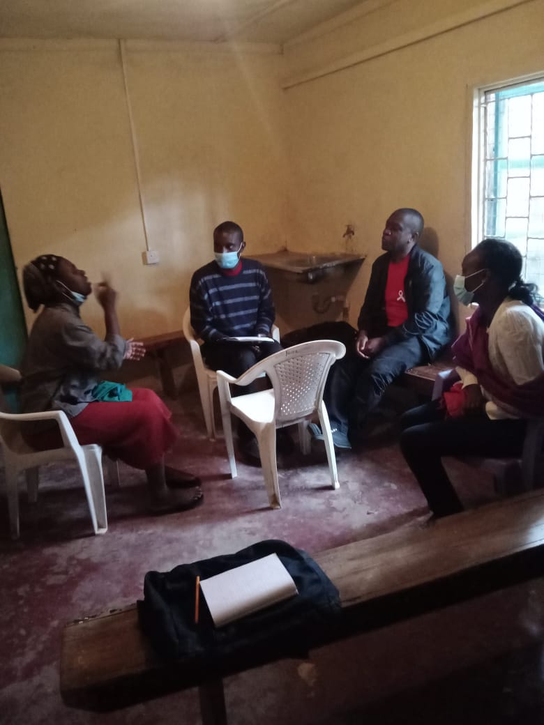 Nelly conducting an interview session with Miriam who is deaf with Eddie doing the sign language translation