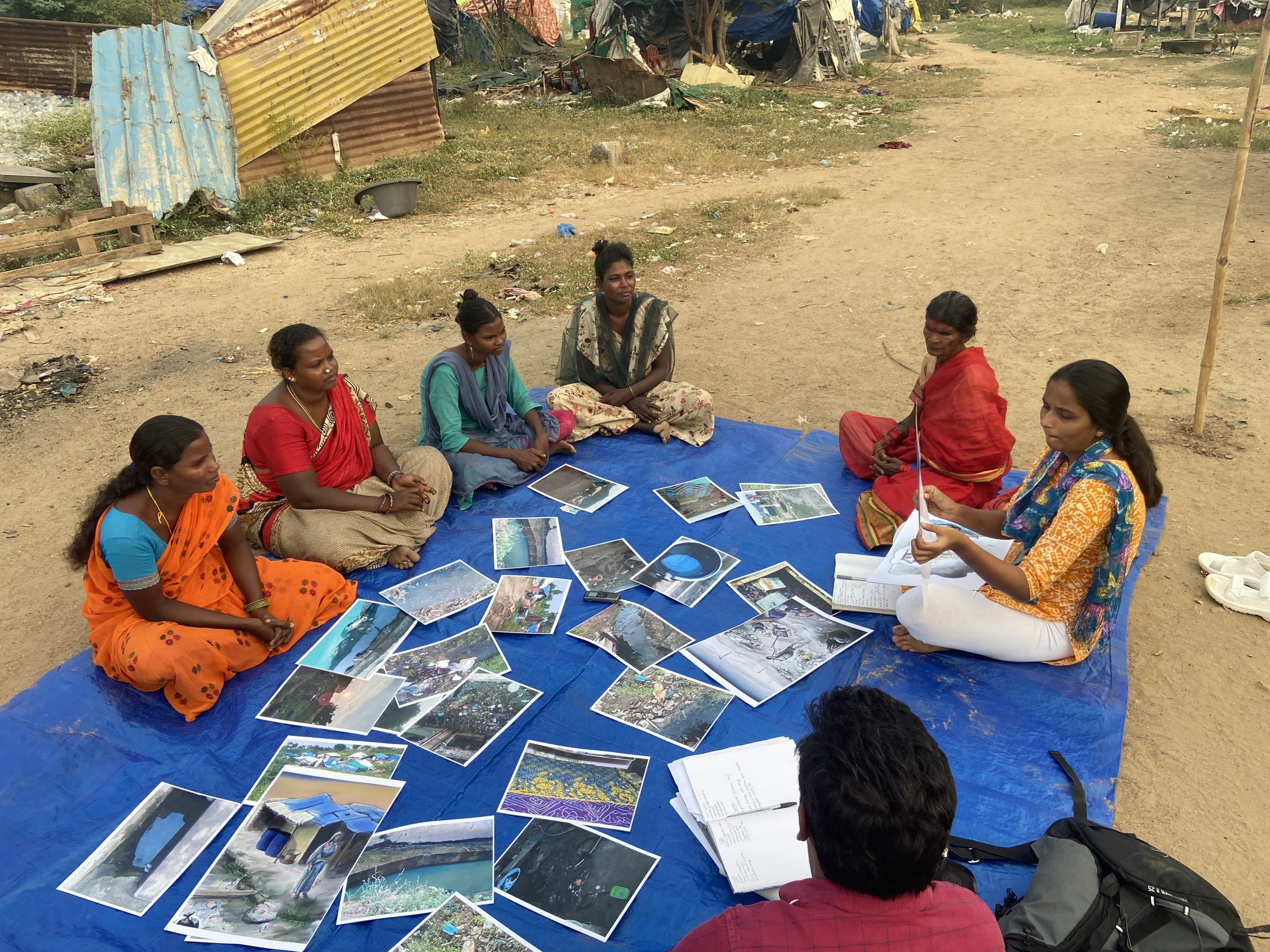 Women in India discussing the photos that they have taken